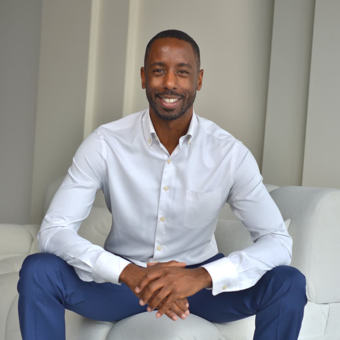 Founder seated in modern office setting